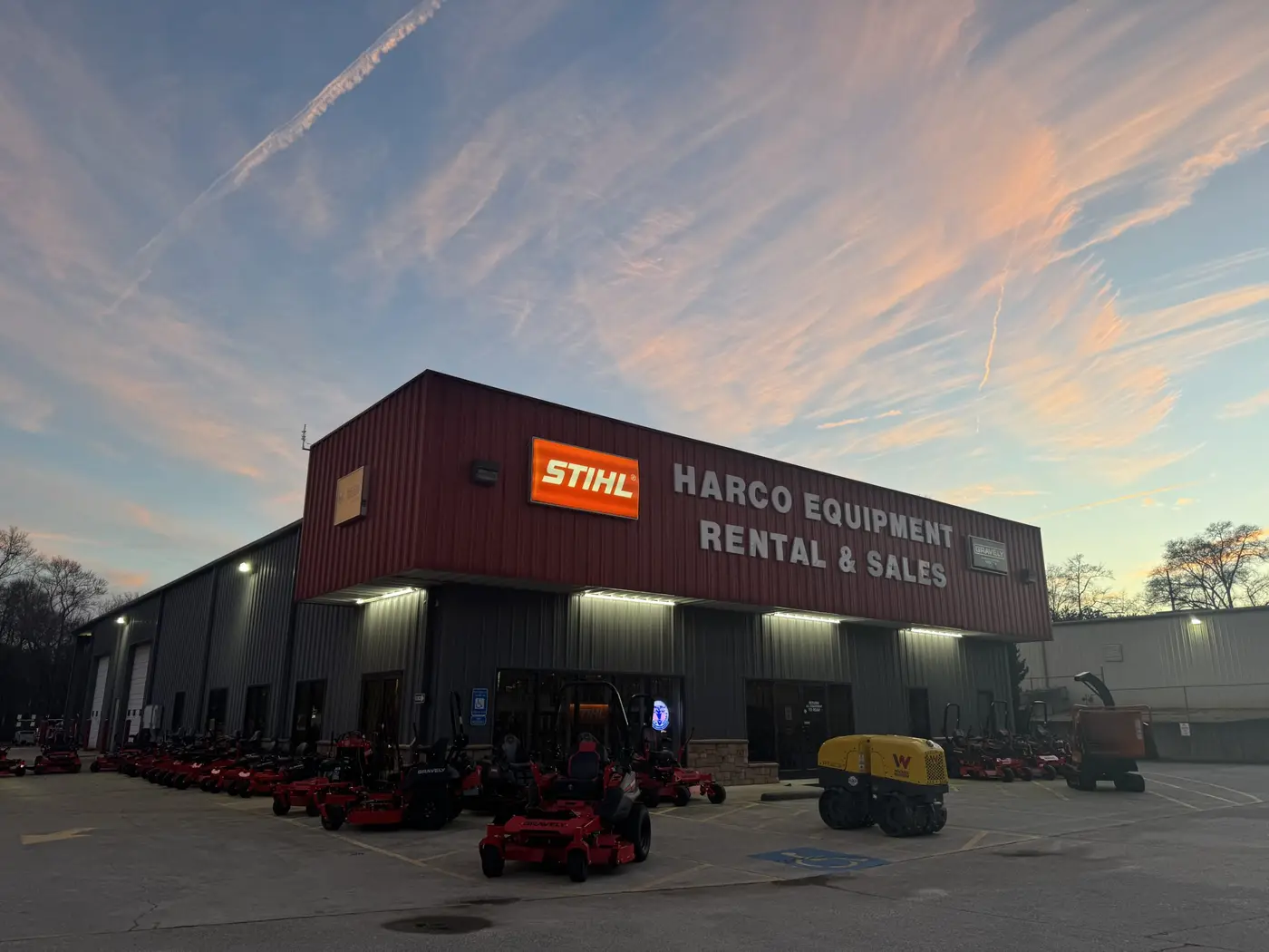A Harco Equipment Rental & Sales store at dusk
